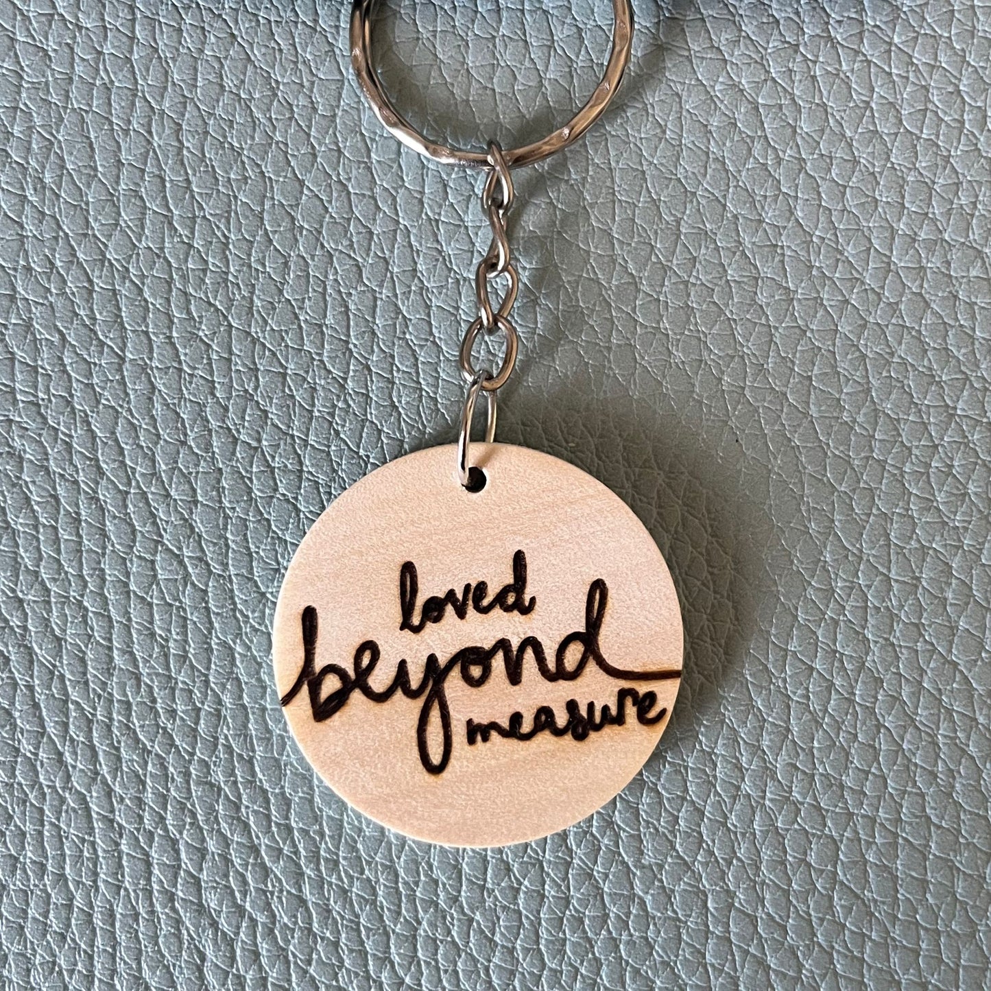 'Loved beyond measure' wooden keyring