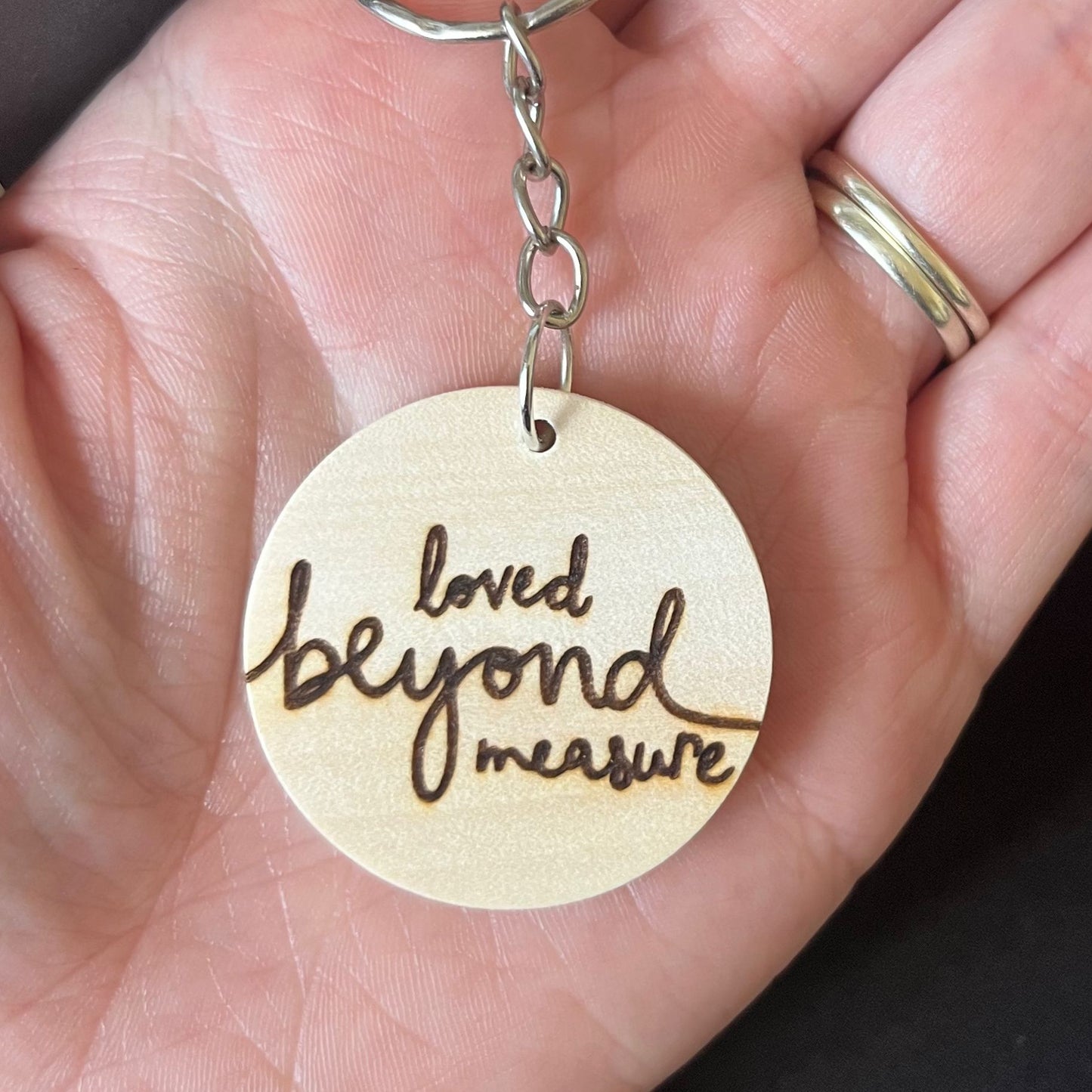 'Loved beyond measure' wooden keyring