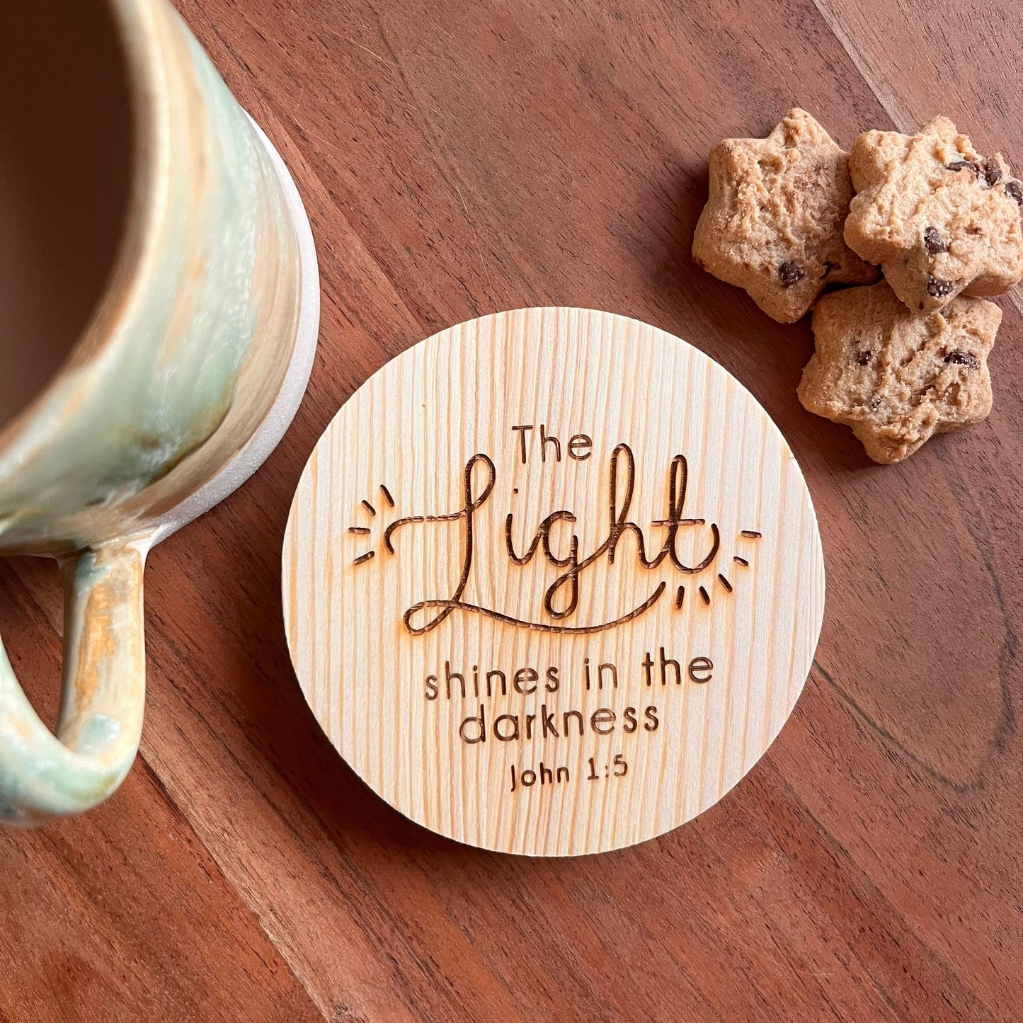 'The light shines in the darkness' wooden coaster