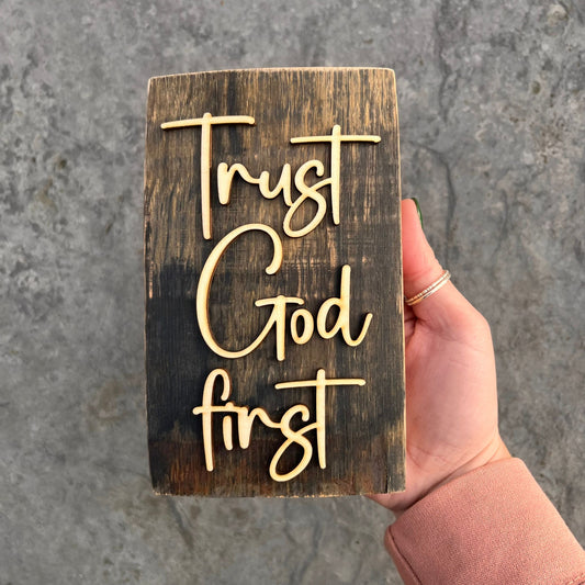 'Trust God first' rustic wooden plaque